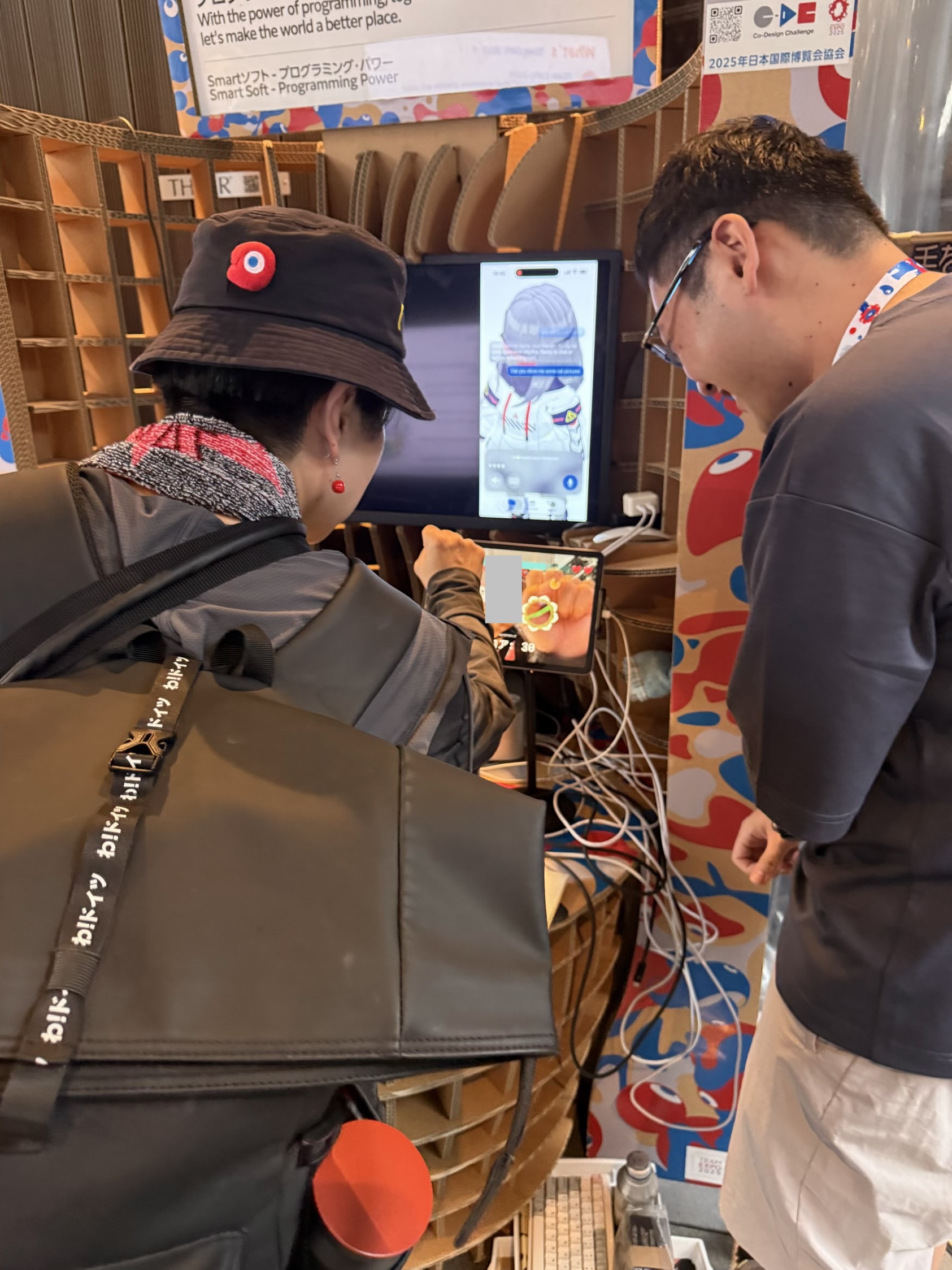 Explaining the booth to Expo visitors.